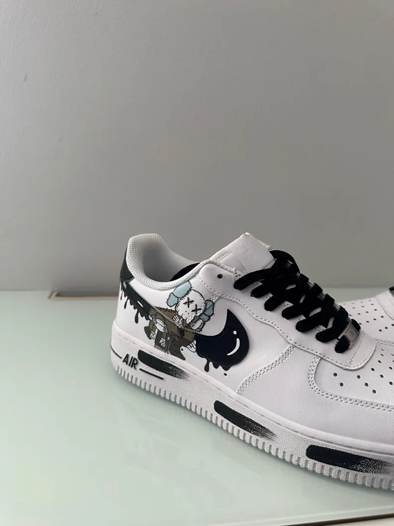 Custom sneakers, Kaws Nike Air Force One, handmade with wash-resistant protection, unique and stylish — perfect as a gift. New Etsy Account, !! So many happy customers an REVIEWS available in vibrant-steps.com. !! Our official website. AVAILABLE FREE SHIPPING TO BELGIUM,GERMANY,SPAIN,FRENCH,AUSTRIA and UK. We also have another shipping option available for US . Looking for the perfect custom gift? These handmade Nike Air Force 1s are personalized just for you — the ultimate statement piece for sneaker lovers. - Image 3